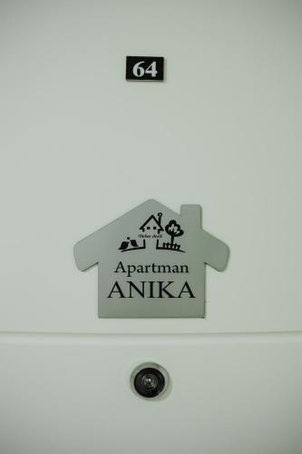 a sign on the door of an apartment in austria at Apartman Anika Banja Koviljača in Banja Koviljača