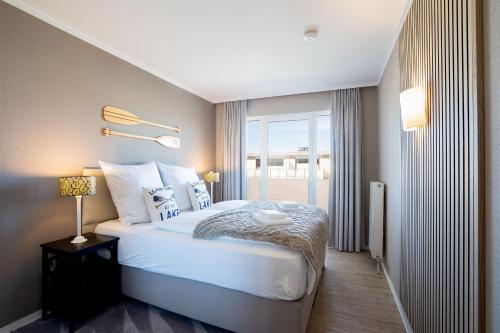 Postel nebo postele na pokoji v ubytování Das Solaris 10 Luxury Beach Apartment mit Balkon, hundefreundlich, individuell