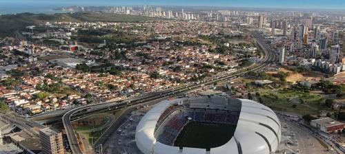 an aerial view of a soccer stadium with a city at Monza Palace Hotel in Natal