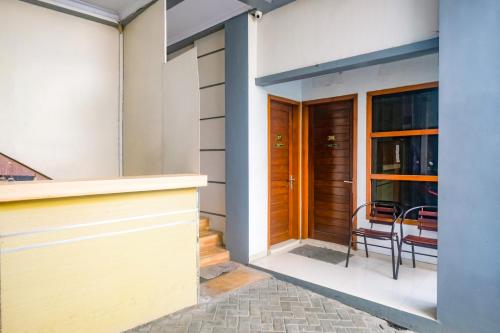 a view of the front door of a house at RedDoorz @ Jalan Kedawung in Malang