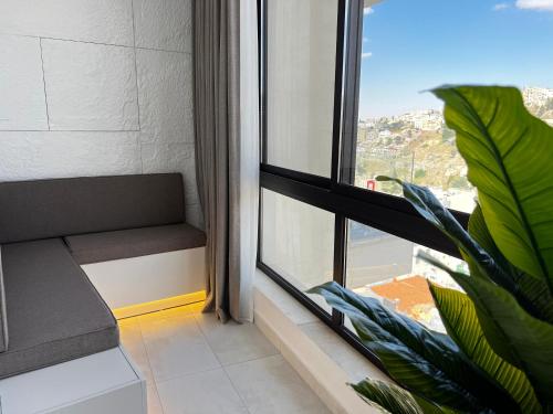Χώρος καθιστικού στο Central Amman Stunning Views Apt