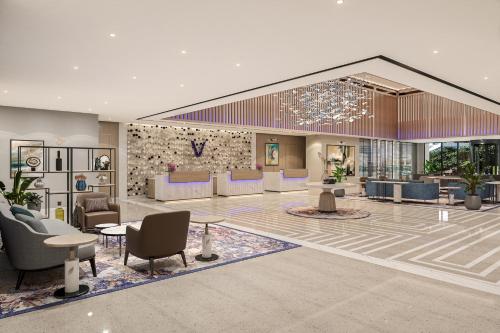 a rendering of a lobby with couches and chairs at Vivanta Thane LBS Road in Thane