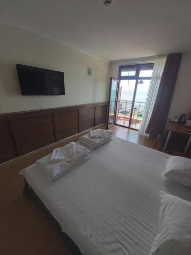 Ένα ή περισσότερα κρεβάτια σε δωμάτιο στο Guest House Skalite
