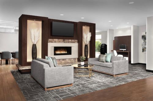 a living room with two couches and a fireplace at TownePlace Suites by Marriott Franklin Cool Springs in Franklin