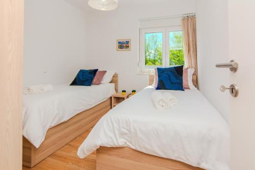 Ένα ή περισσότερα κρεβάτια σε δωμάτιο στο House Calm Forest 5 minutes walking from the Sandy beach