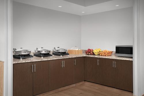 a kitchen with a counter with pots and pans on it at TownePlace Suites by Marriott Franklin Cool Springs in Franklin