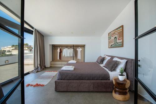 a bedroom with a bed and a couch at The Gem Loft City Apartment in Rhodes Town