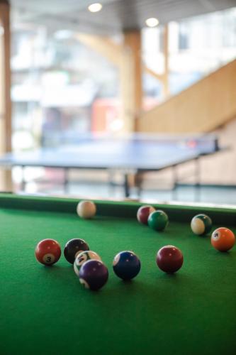 a group of billiard balls on a pool table at Hill River Resort - Central Heated & Air Cooled - Near Mall Road , Best Property of Manali 2024- 2025 in Manāli