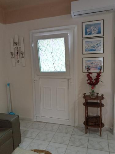 a room with a white door and a window at Poseidon house in Kinion