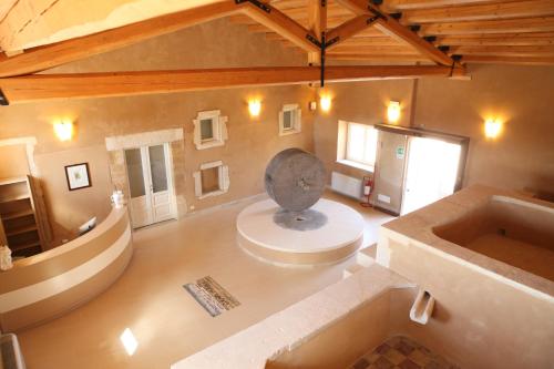 a large room with a statue in the center of a building at Hotel Casale Milocca in Syracuse