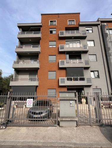 a building with a car parked in front of it at DOWNTOWN apartment Old Town in Podgorica