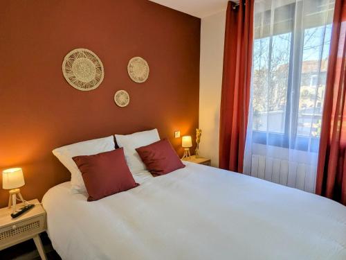 a bedroom with a white bed and a window at Gîte rénové avec jardin à Vignot - FR-1-585-175 in Vignot