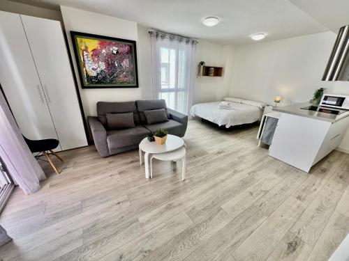 a living room with a couch and a table at Apartamentos Rincón del Mar in Torre del Mar
