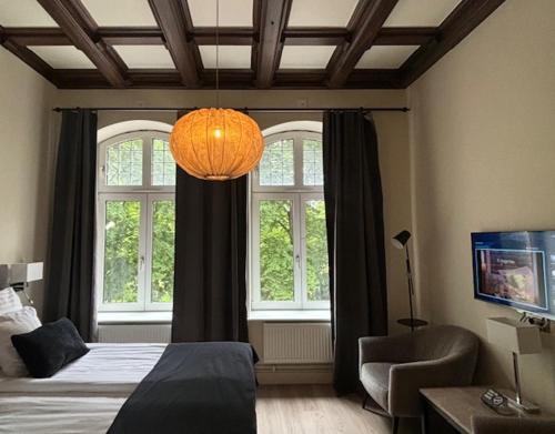 Postel nebo postele na pokoji v ubytování Home Hotel Norre Park