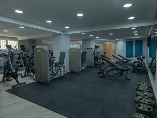 a gym with rows of treadmills and exercise bikes at Hotel LA PALOMA in Tetouan