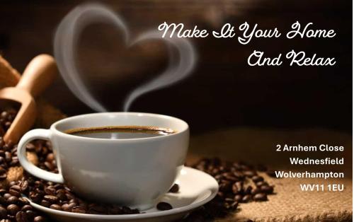 a cup of coffee on a pile of coffee beans at Make It Your Home in Wednesfield