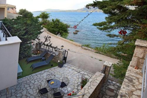 a view of a patio with a view of the water at Salt and Sun in Nikiana