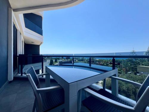 a balcony with a table and chairs and a view at Boutique 16 - Alanya Experience in Alanya
