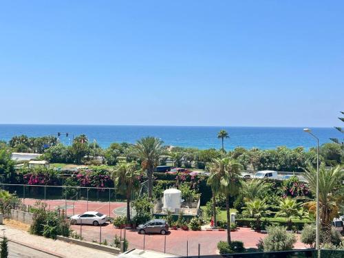 a view of a parking lot with the ocean in the background at Boutique 16 - Alanya Experience in Alanya
