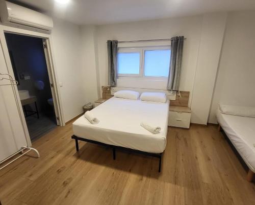 Ένα ή περισσότερα κρεβάτια σε δωμάτιο στο Beach & Arts Hostel Valencia