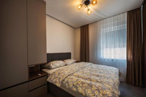 a bedroom with a bed and a window at Villa PADRE in Imotski