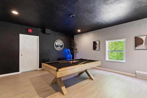 a room with a pool table in it at Puzzle Peak cottage in Nashville