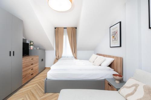 a bedroom with two beds and a window at Nowy Hotel Monika - by Upstairs in Kraków