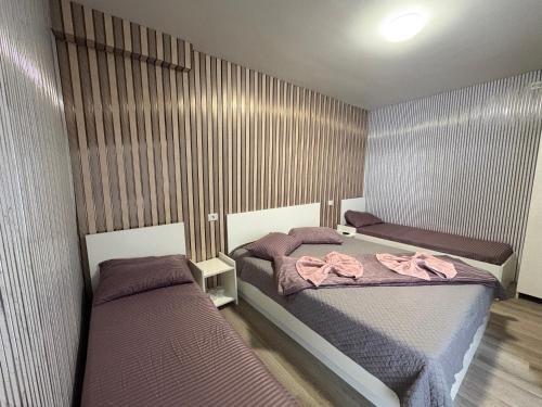 Postel nebo postele na pokoji v ubytování Ama House