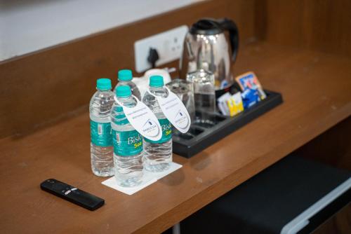 a group of bottles of water sitting on a counter at Bamboo Saa Mulberry Resort Pushkar in Pushkar