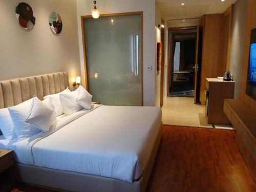 Postel nebo postele na pokoji v ubytování Marrievilla Hotel & Resort