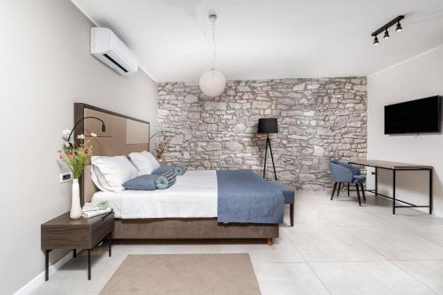 Ένα ή περισσότερα κρεβάτια σε δωμάτιο στο Al Porto Suites - NEW!