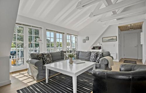 a living room with a couch and a table at Apartment Klint Strandvej Nykøbing Sj Vi in Højby