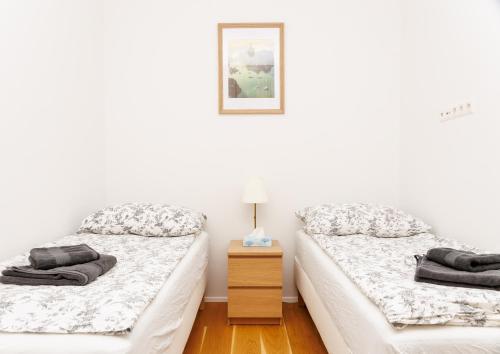 Posteľ alebo postele v izbe v ubytovaní 2 beds top apart in vienna's heart