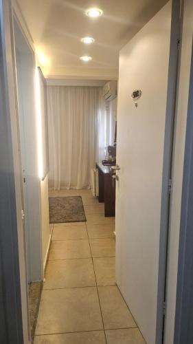 a hallway of a room with a kitchen and a door at Salma Hotel Cairo in Cairo