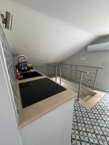 a kitchen with a sink and a stove at B&B Vista Mare in Rodi Garganico