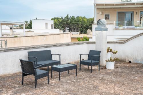 a group of chairs sitting on top of a roof at Case Vacanze Otranto in Otranto