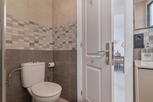 a bathroom with a toilet and a sink at Apartment Taurito big terrace in Taurito