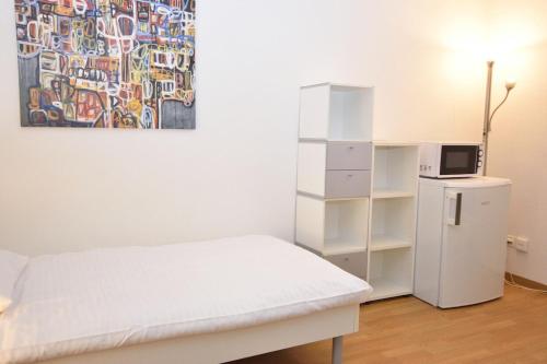 Postel nebo postele na pokoji v ubytování Practical studio at trendy location - Stork 22
