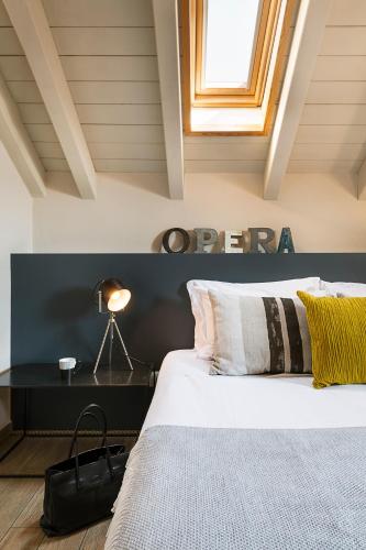a bedroom with a bed and a window at Residenza Dell' Opera in Turin