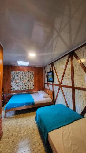 Postel nebo postele na pokoji v ubytování Eco Hotel La Selecta Pereira