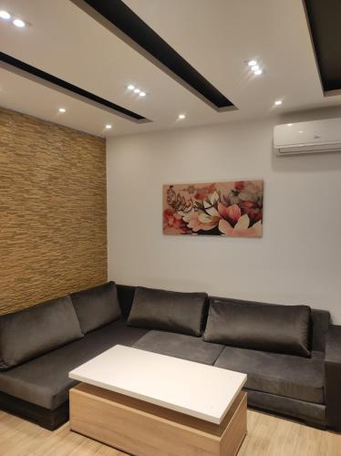 a living room with a couch and a table at EIina in Zarzis
