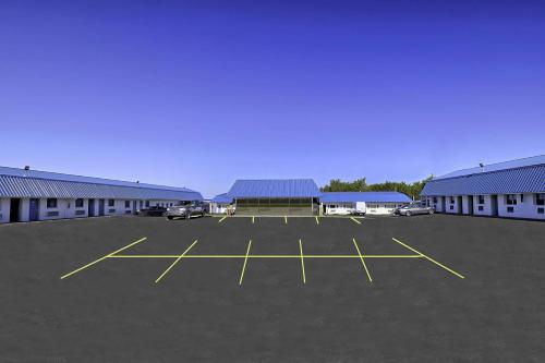 a parking lot in front of a building at Motel 6 Sullivan MO in Sullivan