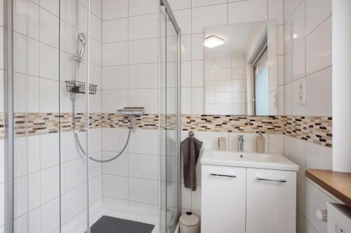 a bathroom with a shower and a sink at Haus Tannenberg in Todtnau