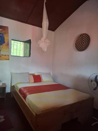 Una cama o camas en una habitación de Hôtel Kiriboungni chez sylfatou