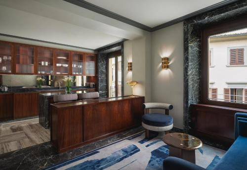 a lobby with a reception desk and a bar at Palazzo Ottaviani - Luxury Apartments in Florence