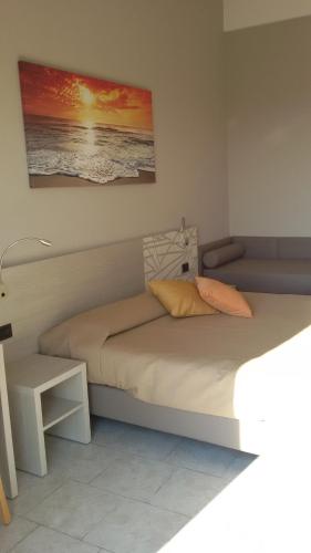 Postel nebo postele na pokoji v ubytování Hotel Cinzia