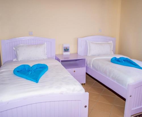 Ένα ή περισσότερα κρεβάτια σε δωμάτιο στο Casa Haven Homestay Naivasha
