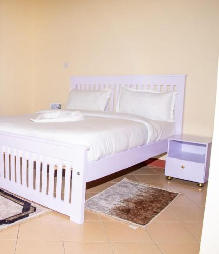 Ένα ή περισσότερα κρεβάτια σε δωμάτιο στο Casa Haven Homestay Naivasha