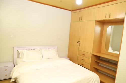 Ένα ή περισσότερα κρεβάτια σε δωμάτιο στο Casa Haven Homestay Naivasha