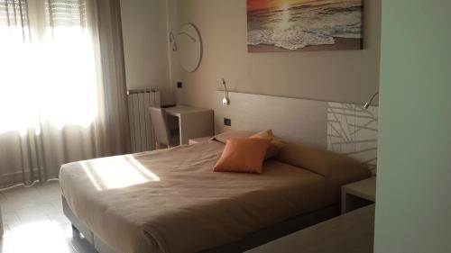 Кровать или кровати в номере Hotel Cinzia